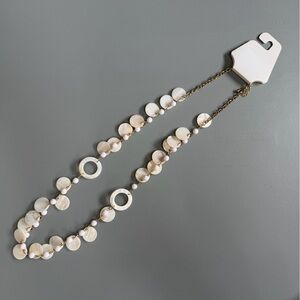 Elegant Cream Necklace with Gold Accents